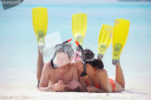 Image of happy young couple have fun on beach