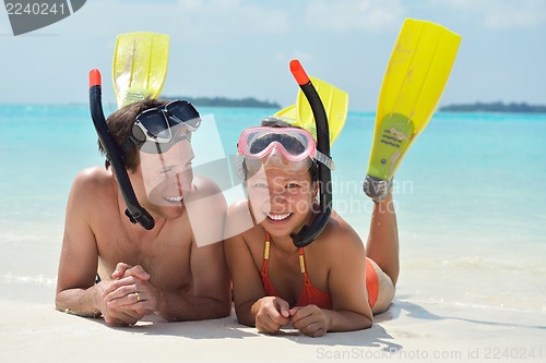 Image of happy young couple have fun on beach