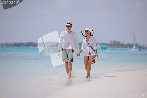 Image of happy young couple have fun on beach