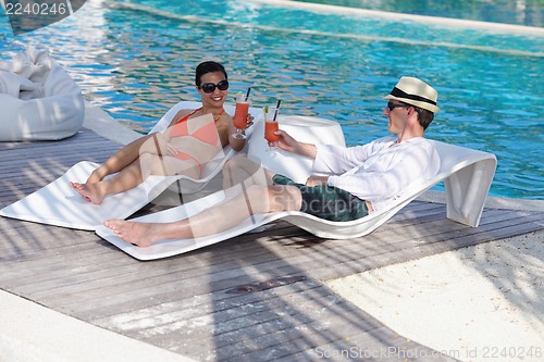 Image of happy young couple have fun on beach