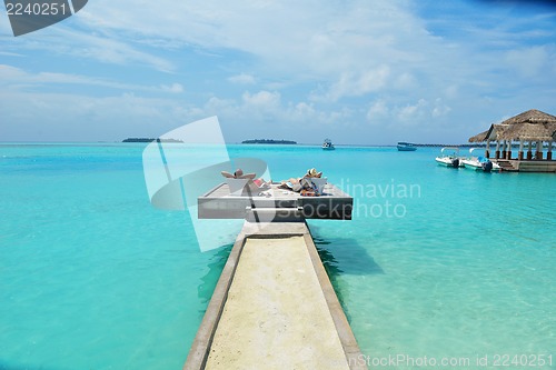 Image of happy young couple have fun on beach