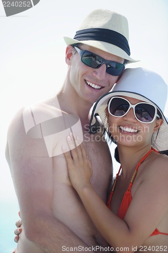 Image of happy young couple have fun on beach