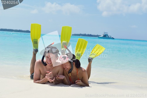 Image of happy young couple have fun on beach