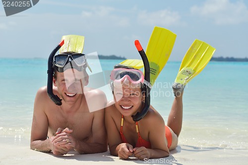 Image of happy young couple have fun on beach
