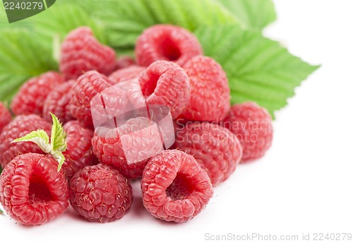 Image of Ripe raspberry with green leaf