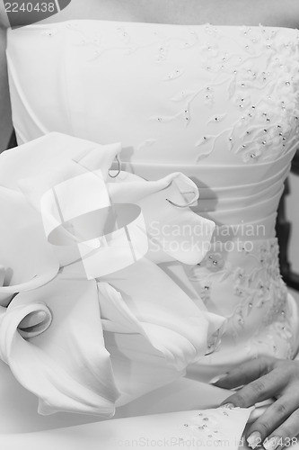 Image of wedding flower in hand black and white toned
