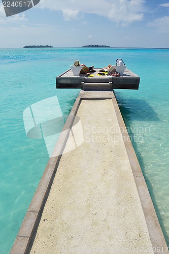 Image of happy young couple have fun on beach