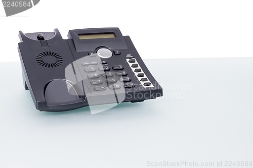 Image of voip phone on glass desk