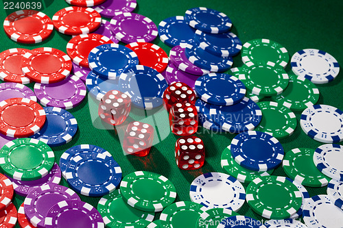 Image of Colorful poker chips and red dice