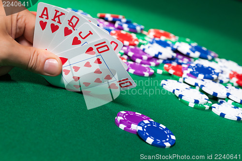 Image of Colorful poker chips and royal flush