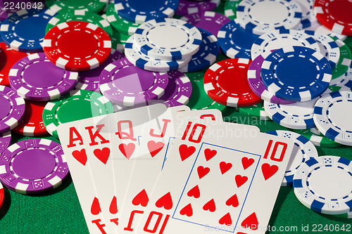 Image of Colorful poker chips and royal flush