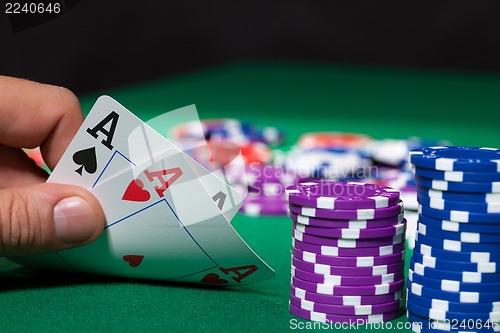 Image of Colorful poker chips and two Ace