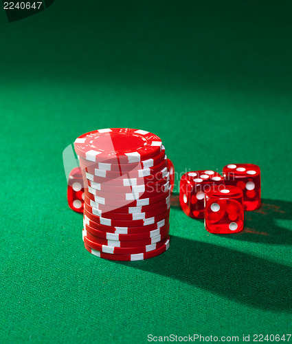 Image of Red poker chips and red dice