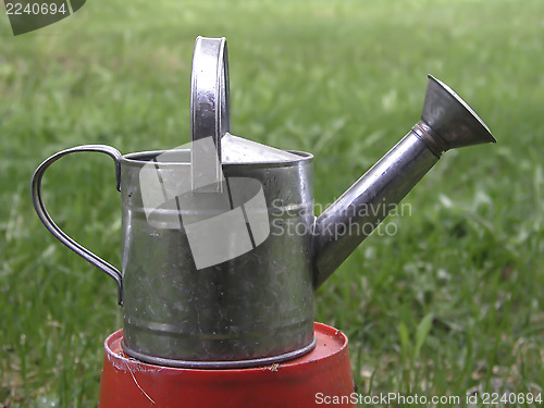 Image of old watering can