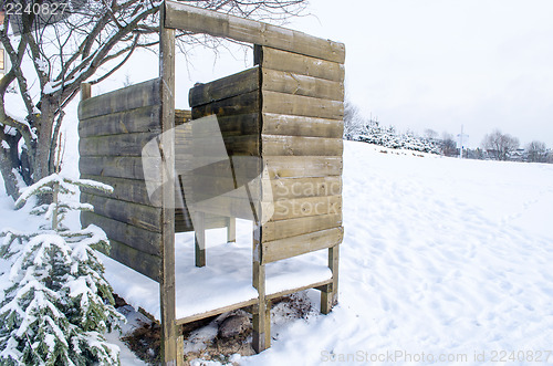 Image of wooden planks nailed beach changing booth snow 
