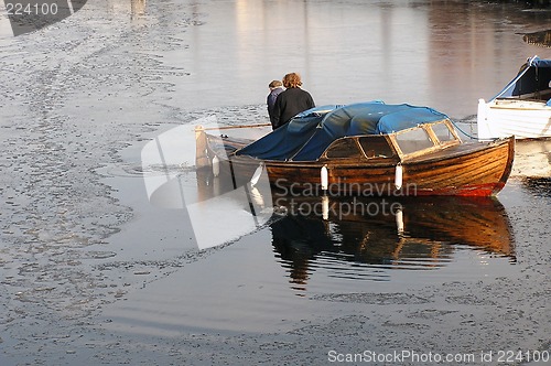 Image of Old boat in cold water