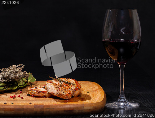 Image of Grilled steak with glass red wine