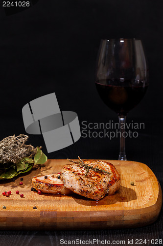 Image of Grilled steak with glass red wine