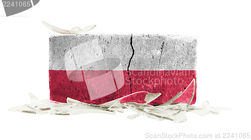 Image of Brick with broken glass, violence concept