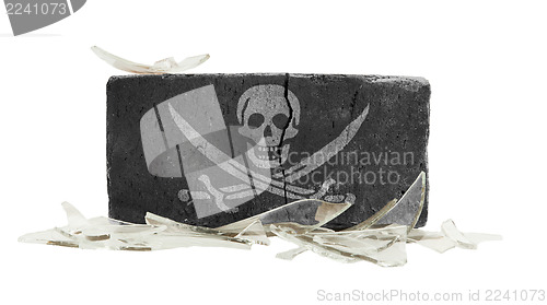 Image of Brick with broken glass, violence concept