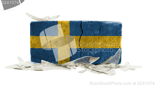 Image of Brick with broken glass, violence concept