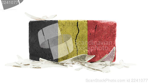 Image of Brick with broken glass, violence concept