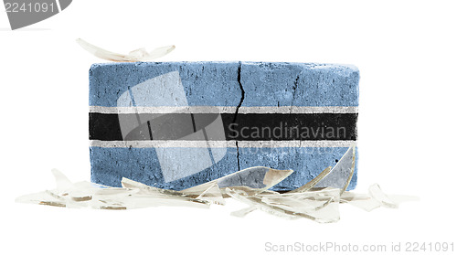 Image of Brick with broken glass, violence concept