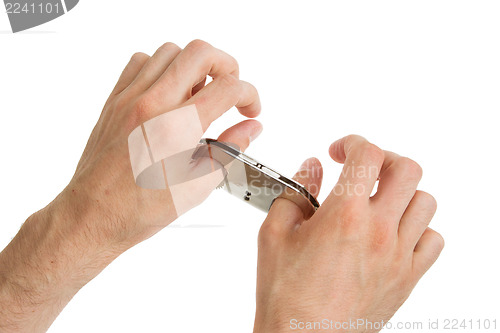 Image of Adult hands in thumb cuffs isolated