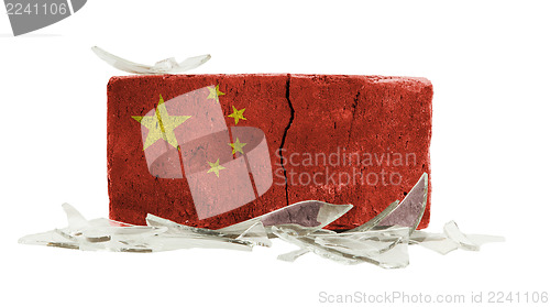 Image of Brick with broken glass, violence concept