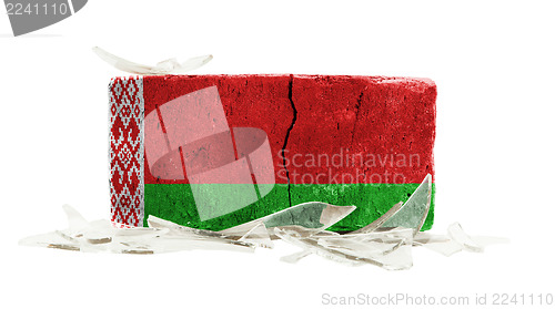 Image of Brick with broken glass, violence concept