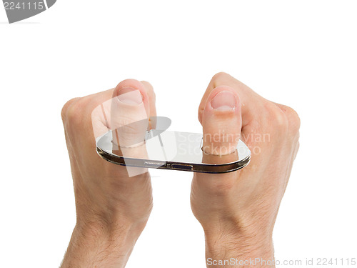Image of Adult hands in thumb cuffs isolated