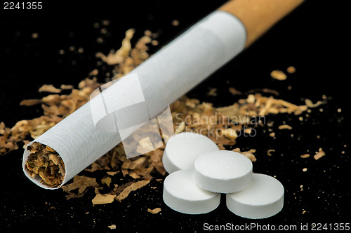 Image of Cigarette, tobacco and pills