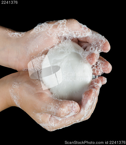 Image of Lathered hands and soap