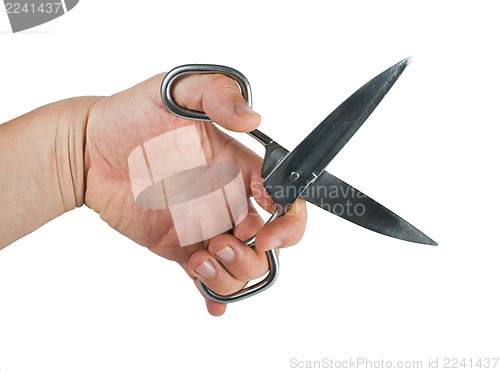 Image of Hand and metal scissors