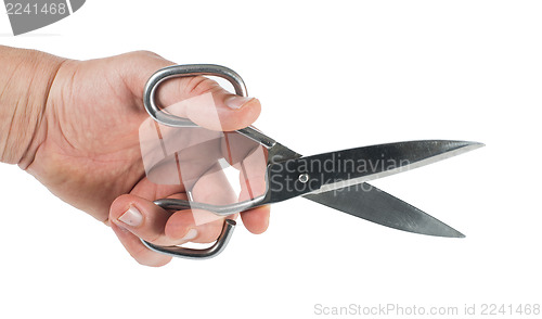 Image of Hand and metal scissors