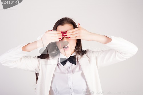 Image of shocked young woman with closwd eyes