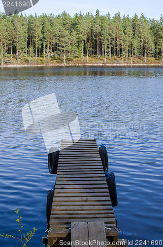 Image of Old jetty at calm lake