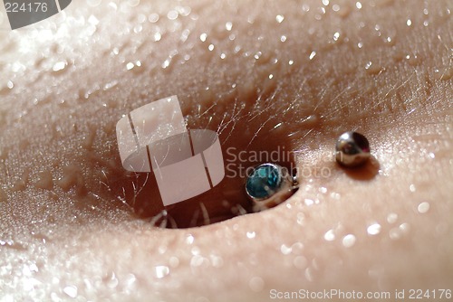 Image of female belly piercing