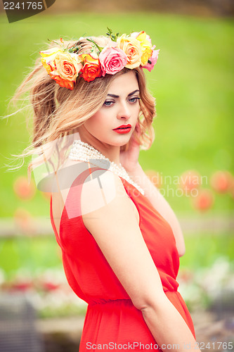 Image of beautiful woman portrait outdoor with colorful flowers