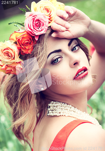 Image of beautiful woman with roses outdoor summertime