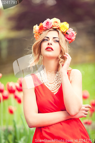 Image of beautiful woman portrait outdoor with colorful flowers