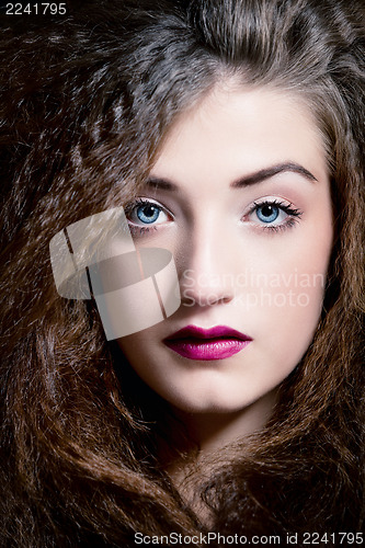 Image of beautiful brunette woman with blue eyes