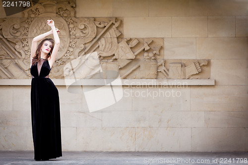 Image of beautiful woman in long dress fashion outdoor
