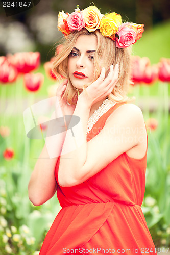 Image of beautiful woman portrait outdoor with colorful flowers