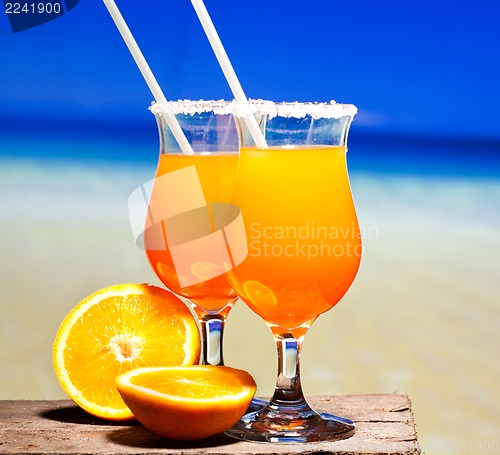 Image of Tequila Sunrise Cocktail on wooden planks