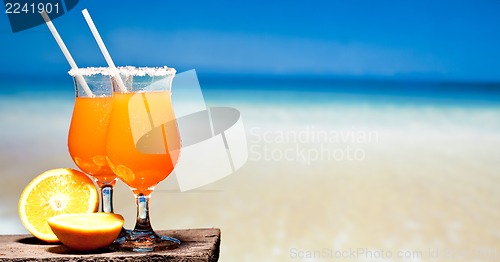 Image of Tequila Sunrise Cocktail on wooden planks