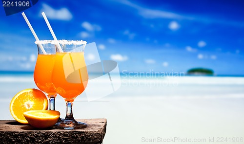 Image of Tequila Sunrise Cocktail on wooden planks