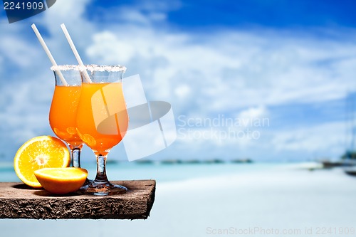 Image of Tequila Sunrise Cocktail on wooden planks