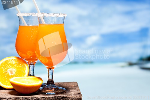 Image of Tequila Sunrise Cocktail on wooden planks