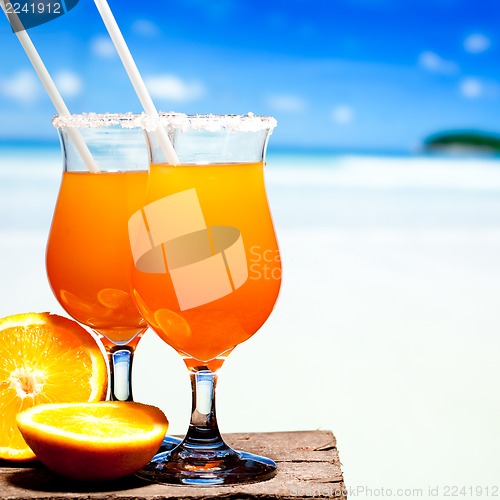 Image of Tequila Sunrise Cocktail on wooden planks